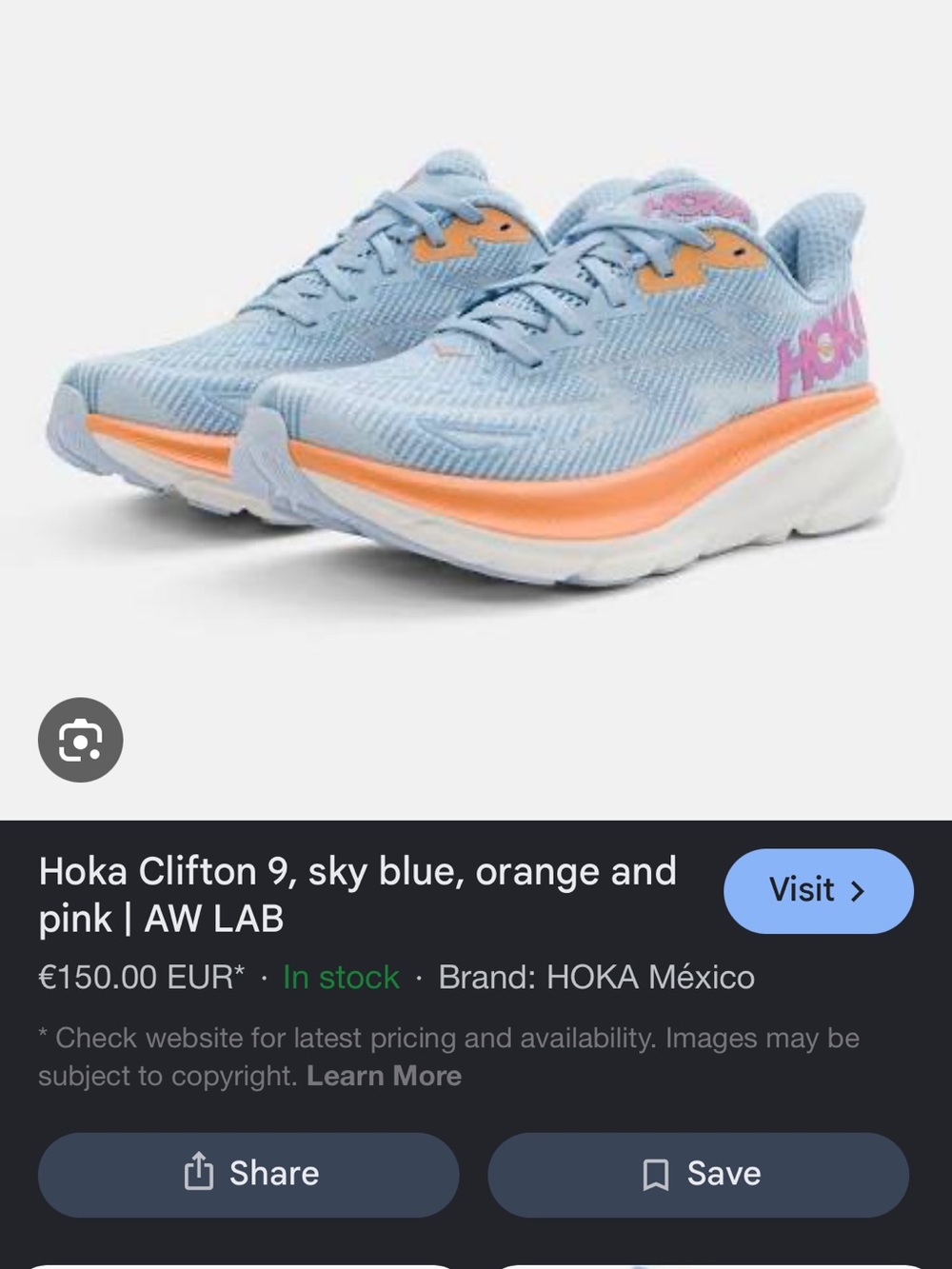 Hoka light blue running shoes with orange & pink accents